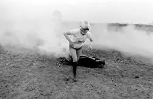 Stunt woman rides through flames on motorbike