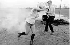 Stunt woman rides through flames on motorbike