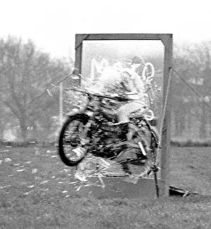 Stunts Collection: Stunt woman rides her motorbike through a glass plate, shattering it as she speeds through