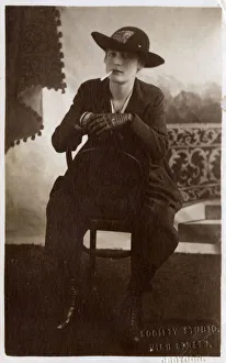 Smoker Gallery: Very Stylish Young Woman stitting backward on a chair