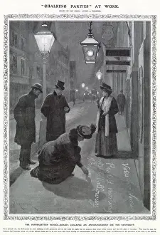 A Suffragette publicises a protest meeting by chalking it onto a pavement. Date: 1908