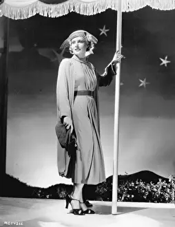Suit and cape designed by Dolly Tree for Madge Evans