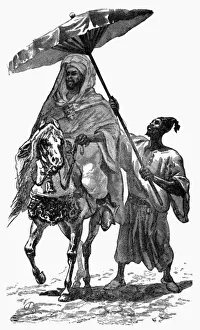 A Sultan of Morocco on horseback with attendant