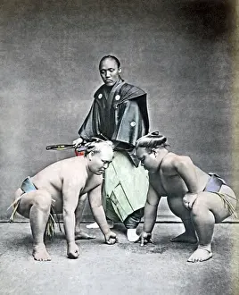 Wrestlers Prints: Sumo wrestlers and referee, Japan, 1870s