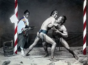 Wrestlers Prints: Sumo wrestlers and referee, Japan, circa 1890. Date: circa 1890