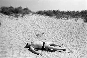 Relax Gallery: Sunbathing man on beach Newport, near Great Yarmouth