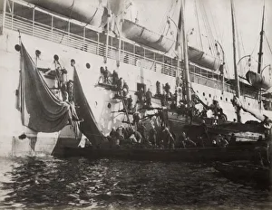 Supplies being loaded on a ship in harbour, Asia