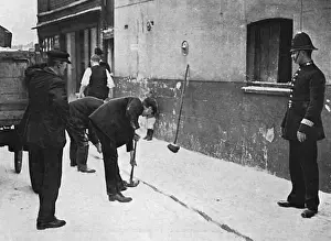 Businesses Prints: Sweeping up flour after attack on German bakery, WW1