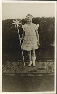 Jan21 Prints: A sweet little girl dressed up in a fairy costume. Shes standing on a rather nice rug in