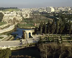 Cityscape Prints: Syria. Hama. General view and the noria in the Orontes river