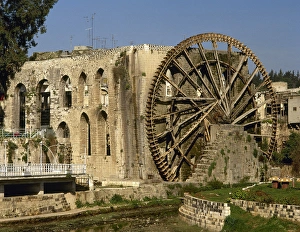 Syria. Hama. Noria in the Orontes river next to the aqueduct Syria. Hama. Noria in the Orontes river next to the aqueduct