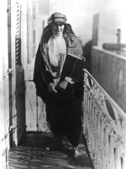 T E Lawrence (Lawrence of Arabia) on a balcony