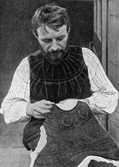 Images Dated 28th August 2018: Tailor embroidering waistcoat, Brittany, Northern France
