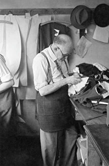 Balding Collection: Tailor at work on a garment