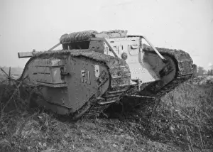 Tank breaking through barbed wire barricade