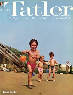 Tatler Front Cover - Three small children, two boys and a girl, are playing on the beach at Frinton-on-Sea, holding blue and orange balloons on strings