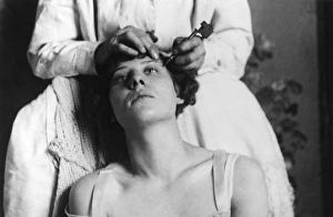 Images Dated 12th May 2011: Tattooing the Eyebrows