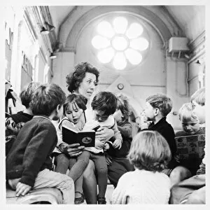 Mixed Gallery: Teacher reading to infants, Brentwood, Essex