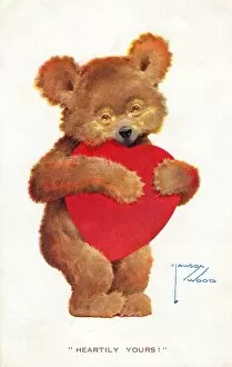 Teddy bear with a large red heart on a Valentine postcard
