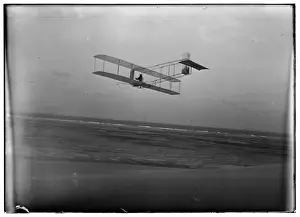 Three-quarter left rear view of glider in flight at Kitty Ha