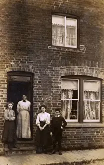 Doorstep Prints: Threshold Photograph - family outside their terraced home
