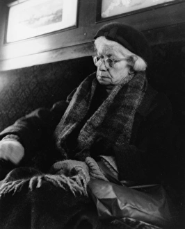 Images Dated 26th May 2017: Tired elderly woman sleeping on a train