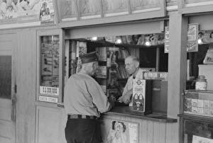 Tobacco dealer waiting on motorman at streetcar terminal, Ok Tobacco dealer waiting on motorman at streetcar terminal, Ok