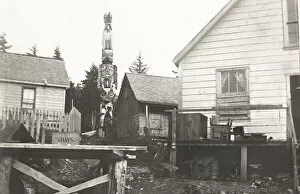 Alaska Collection: Totem pole and houses Ketchikan, Alaska