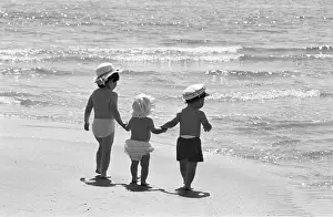 Growing Prints: Three tots on beach, Tenby