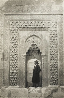 Alcove Gallery: A tourist before an elaborate Turkish carved alcove