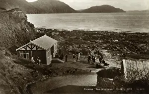 Traditional cottage at Niarbyl, Isle of Man, with film crew