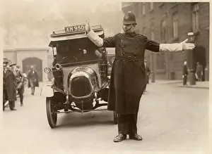 Controlling Prints: Traffic Policeman directing the traffic at Parliament Street, London. Date: circa 1930