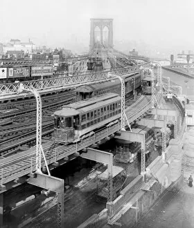 Train on the elevated railway approach to Brooklyn Bridge, B
