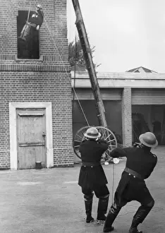 Drills Prints: Trainee lowered from tower during exercise drill, WW2