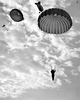 Barrage Prints: Trainee paratroops descending from a Barrage Balloon