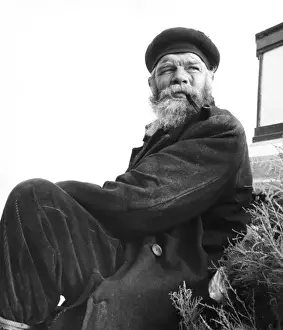 Tramp sitting on grass, Balham, SW London