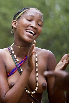 Images Dated 16th December 2006: Tribal Dancer - Bushmen Girl dancing in Manghetti dunes