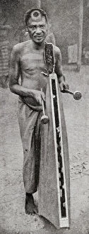 Images Dated 4th September 2018: Tribesman playing tattoo, French Congo, Central Africa