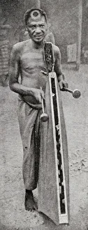 Images Dated 4th September 2018: Tribesman playing tattoo, French Congo, Central Africa