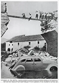 Fierce Collection: A triumphant group of Republican standing on the remains of a bridge in the Guadarrama region of