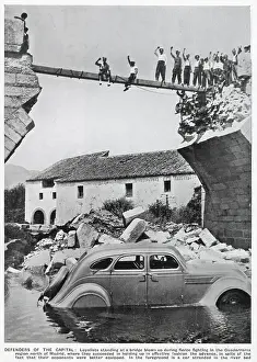 Nationalists Prints: A triumphant group of Republican standing on the remains of a bridge in the Guadarrama region of Spain