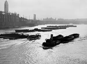 Blackfriars Prints: A tug and lighters, from Blackfriars, with the OXO tower on the opposite bank