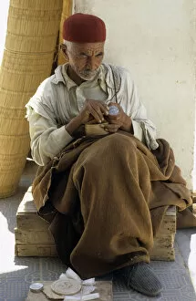 Tunisian Collection: Tunisian man sits in shade