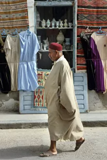 Images Dated 4th September 2019: A Tunisian man wearing a djelleba and a chechia hat