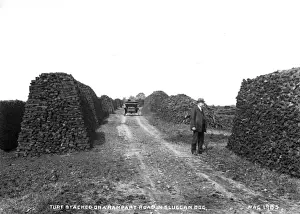 Turf Stacked on a Rampart Road in Sluggan Bog
