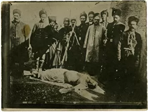 Turkey - Ottoman Soldiers surround a slain Armenian Man