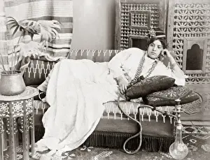 Turkish dancer with a hookah, circa 1890