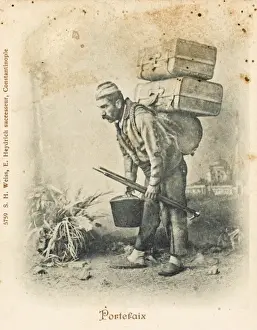 Turkish porter carrying two suitcases
