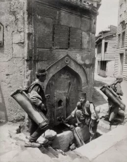 Turkish water carriers filling bags, Constantinople, Istanbu