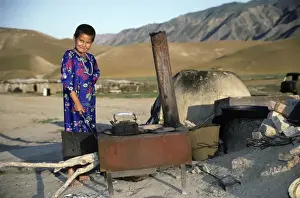 Habitat Prints: Turkmen girl - in traditional dress - boils water